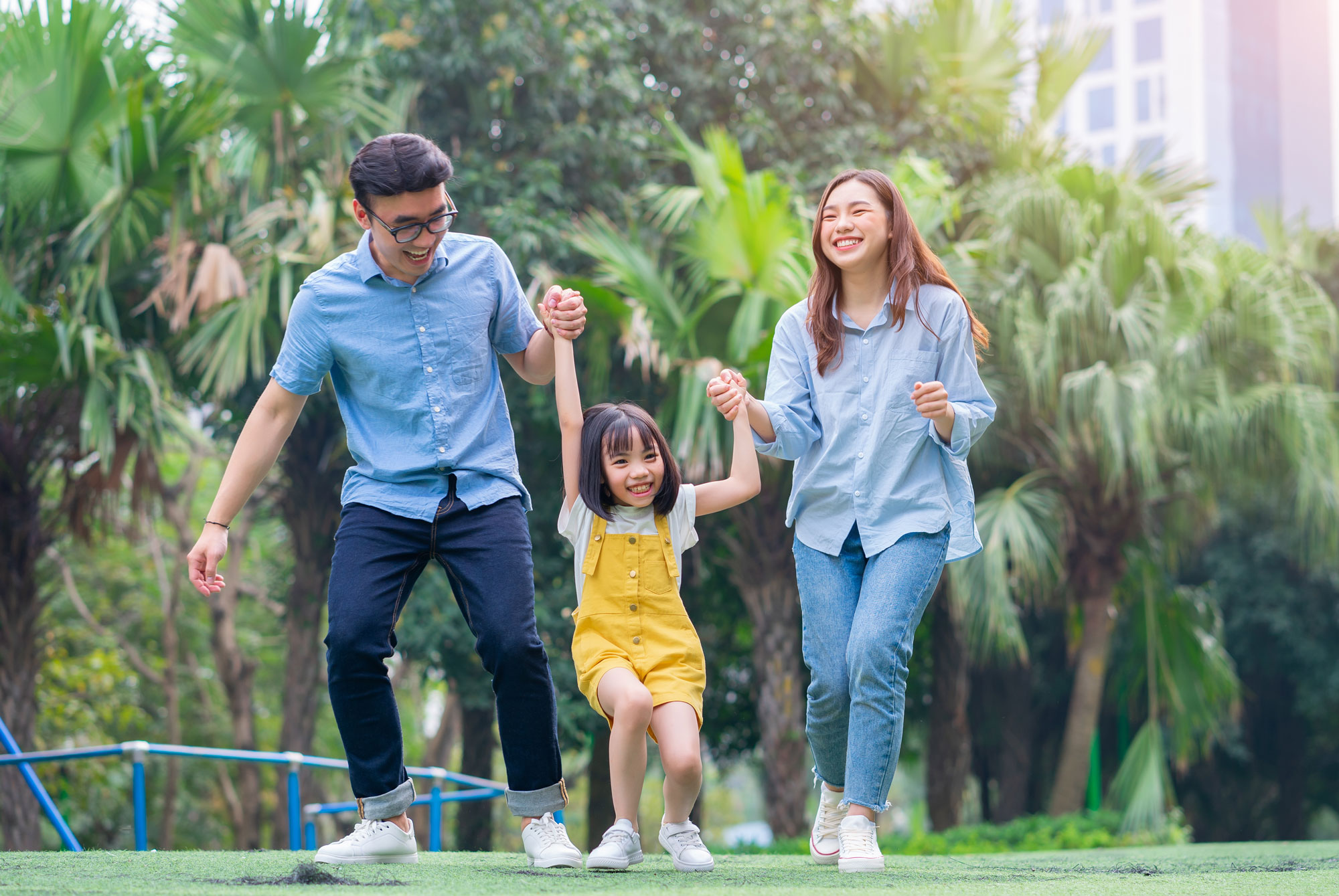 Image-of-young-Asian-family-playing-together-at-park_By-Timeimage
